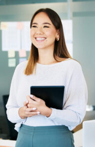 Office, business woman and tablet in planning for project, career and administration as professional. Female person, thinking and technology for company, management and accounting firm in bookkeeping Happy entrepreneur with her small business accounting services